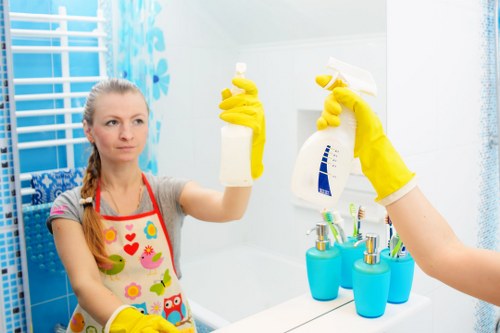 Professional oven cleaner in Kensington preparing equipment with safety gear
