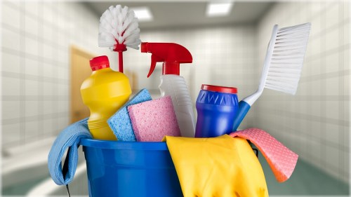 Cleaner preparing oven cleaning equipment safely before service
