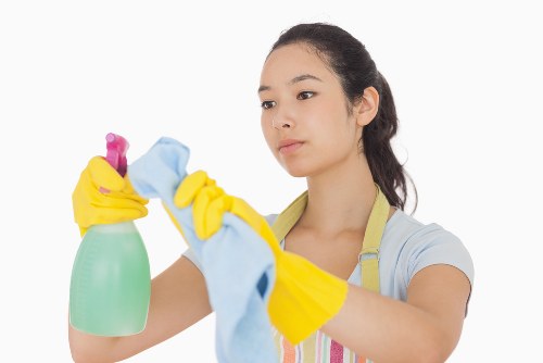 Professional oven cleaning service in Kensington restoring a grease-covered oven