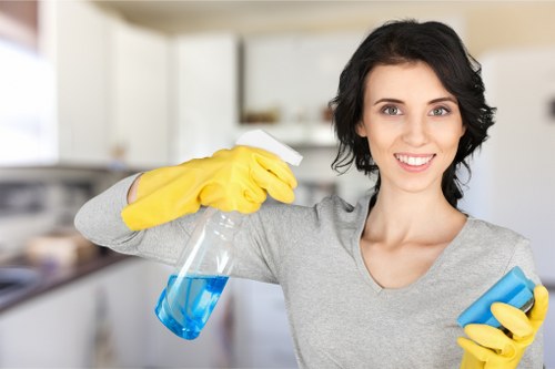 Technician checking kitchen hazards before oven cleaning begins