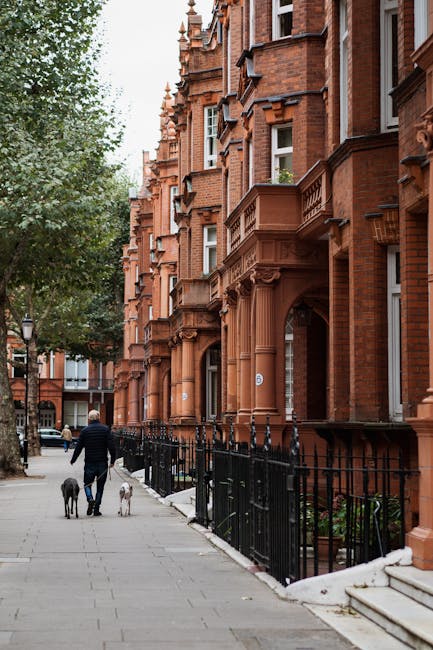 A rectangular metal street sign affixed to a red brick wall, displaying the text 'Welcome to South Kensington' in uppercase black font, with 'SW7' in red at the bottom right corner and 'Welcome to' in
